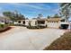 Front view of a single story home with a large driveway at 6226 Hampton N Ct, St Petersburg, FL 33710