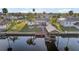 Aerial view of waterfront home with private dock and lush landscaping at 713 Gran Kaymen Way, Apollo Beach, FL 33572