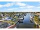 Aerial view of waterfront properties with boat docks at 713 Gran Kaymen Way, Apollo Beach, FL 33572