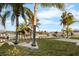 Backyard with canal views and palm trees at 713 Gran Kaymen Way, Apollo Beach, FL 33572