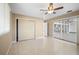 Bedroom with ceiling fan and sliding glass doors to lanai at 713 Gran Kaymen Way, Apollo Beach, FL 33572