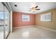 Bright bedroom with ceiling fan and sliding glass doors at 713 Gran Kaymen Way, Apollo Beach, FL 33572