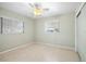 Bedroom with two windows and ceiling fan at 713 Gran Kaymen Way, Apollo Beach, FL 33572
