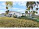 Single-story home with mature palm trees at 713 Gran Kaymen Way, Apollo Beach, FL 33572