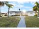 Charming waterfront home with a sunlit walkway at 713 Gran Kaymen Way, Apollo Beach, FL 33572
