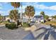 House with circular driveway and palm trees at 713 Gran Kaymen Way, Apollo Beach, FL 33572