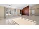 Living room with wood wall and view of the canal at 713 Gran Kaymen Way, Apollo Beach, FL 33572