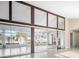 Bright living room with sliding doors to a sunroom and water views at 713 Gran Kaymen Way, Apollo Beach, FL 33572