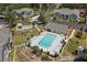 Community pool and surrounding buildings at 7713 Hillside Ct # 201, Hudson, FL 34667