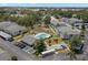 Aerial view of community with pool, shuffleboard, and parking at 7713 Hillside Ct # 201, Hudson, FL 34667