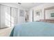 Bedroom with full bed and bi-fold doors at 7713 Hillside Ct # 201, Hudson, FL 34667