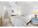 Spacious bedroom with a king-size bed and ceiling fan at 7713 Hillside Ct # 201, Hudson, FL 34667