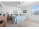 Bedroom with full bed and wood dresser at 7713 Hillside Ct # 201, Hudson, FL 34667