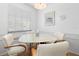 Small dining area with round table and four chairs at 7713 Hillside Ct # 201, Hudson, FL 34667