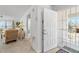 Entryway with white door and view into living room at 7713 Hillside Ct # 201, Hudson, FL 34667