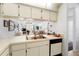 Kitchen with view into adjacent living room at 7713 Hillside Ct # 201, Hudson, FL 34667