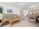 Living room with futon, armchair and coffee table at 7713 Hillside Ct # 201, Hudson, FL 34667