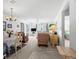 Open living and dining area with light carpeting and furnishings at 7713 Hillside Ct # 201, Hudson, FL 34667