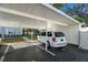 Covered carport parking with additional storage space at 7713 Hillside Ct # 201, Hudson, FL 34667