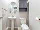 Clean and modern bathroom with pedestal sink and updated fixtures at 8321 Wildflower Glen Ave, Odessa, FL 33556