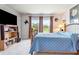 Serene bedroom with a wooden bed frame and views of nature at 8321 Wildflower Glen Ave, Odessa, FL 33556