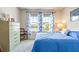 Cozy bedroom with a queen-size bed and plenty of natural light at 8321 Wildflower Glen Ave, Odessa, FL 33556