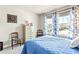 Serene bedroom with a queen-size bed and large window at 8321 Wildflower Glen Ave, Odessa, FL 33556