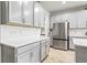 Modern kitchen with gray cabinets and stainless steel appliances at 8321 Wildflower Glen Ave, Odessa, FL 33556