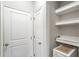 Convenient laundry area with built-in shelving and space for appliances at 8321 Wildflower Glen Ave, Odessa, FL 33556