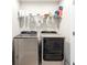 Functional laundry room with washer and dryer at 8321 Wildflower Glen Ave, Odessa, FL 33556