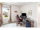 Home office with desk, chair, and ample natural light at 8321 Wildflower Glen Ave, Odessa, FL 33556