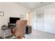 Home office with desk, chair, and ample natural light at 8321 Wildflower Glen Ave, Odessa, FL 33556