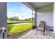 Relaxing screened-in patio overlooking a pond at 8321 Wildflower Glen Ave, Odessa, FL 33556