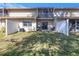 Townhome backyard with patio, screened balcony, and grassy area at 8954 Antigua Dr, Seminole, FL 33777