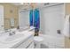 Bathroom with a shower/tub combo and nautical themed curtain at 8954 Antigua Dr, Seminole, FL 33777