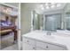 Bathroom with a single vanity and a view into the bedroom at 8954 Antigua Dr, Seminole, FL 33777