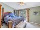 King-size bed in a spacious Primary bedroom with balcony access at 8954 Antigua Dr, Seminole, FL 33777