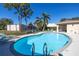 Inviting kidney-shaped community pool at 8954 Antigua Dr, Seminole, FL 33777