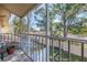 Screened-in porch with treetop views and a small potted plant at 8954 Antigua Dr, Seminole, FL 33777