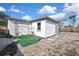 Backyard with artificial turf, pergola, and patio at 9608 Richwood Ln, Port Richey, FL 34668