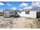Backyard view showing patio and house exterior at 9608 Richwood Ln, Port Richey, FL 34668