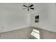 Bright bedroom with ceiling fan and window at 9608 Richwood Ln, Port Richey, FL 34668