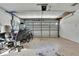 Garage with overhead door, and space for storage at 9608 Richwood Ln, Port Richey, FL 34668