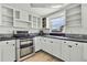 Modern kitchen with stainless steel appliances at 9608 Richwood Ln, Port Richey, FL 34668