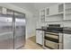 Stainless steel appliances and ample cabinetry highlight this kitchen at 9608 Richwood Ln, Port Richey, FL 34668