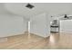Spacious living room with light wood flooring at 9608 Richwood Ln, Port Richey, FL 34668