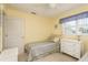 Bright guest bedroom featuring twin bed and dresser at 102 Stafford Dr, Palm Harbor, FL 34684