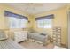 Guest bedroom with twin beds and ample closet space at 102 Stafford Dr, Palm Harbor, FL 34684