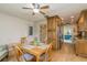 Bright dining area with view into kitchen and living room at 102 Stafford Dr, Palm Harbor, FL 34684