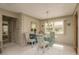 Casual dining area with glass-top table and four chairs at 102 Stafford Dr, Palm Harbor, FL 34684